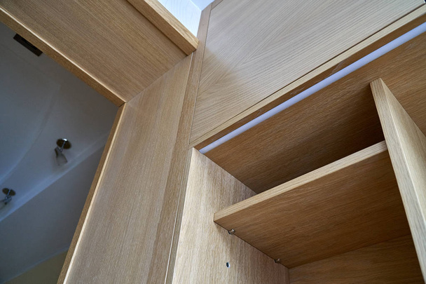 Wooden cupboard with drawers and empty shelves. Modern furniture - Foto, Imagem
