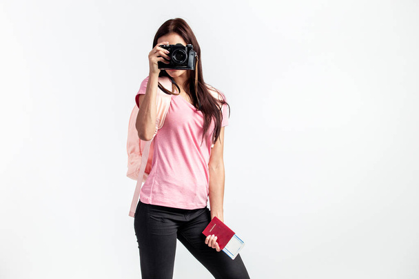 Girl with a backpack on her shoulders dressed in pink t-shirt an - 写真・画像