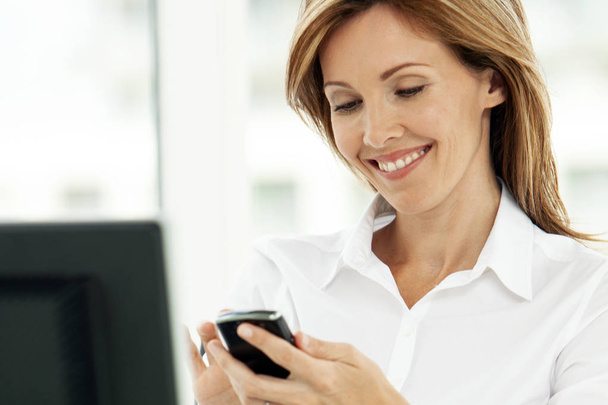 Woman on the phone - businesswoman using phone in office - corporate executive - Foto, Imagem