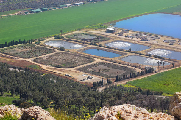 views of the Jezreel Valley and fish breeding ponds from the heights of Mount Precipice, located just outside the southern edge of Nazareth, Lower Galilee, Israel - Photo, Image