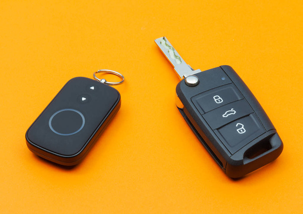 Opened Car Key with Remote Control on an orange background - Photo, Image
