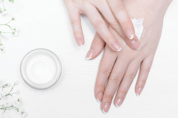 Cosmetic natural cream in a jar on a white table background. - Foto, Bild