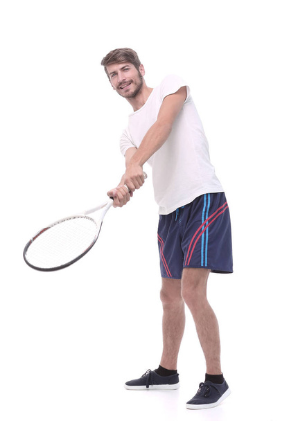in full growth. a young man with a tennis racket - Φωτογραφία, εικόνα