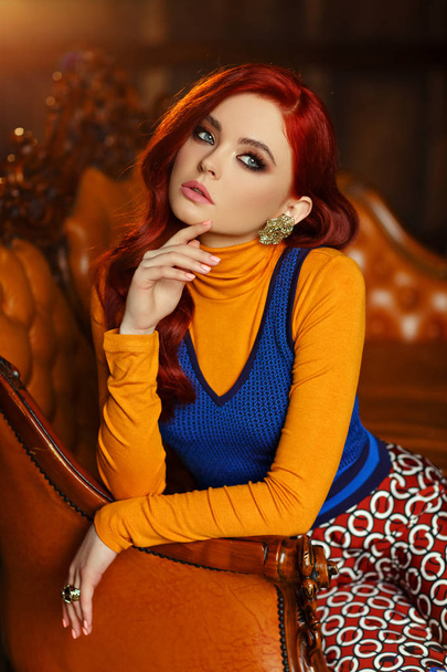 Beautiful sexy redheaded girl in a trendy style and leopard shoe - Fotografie, Obrázek