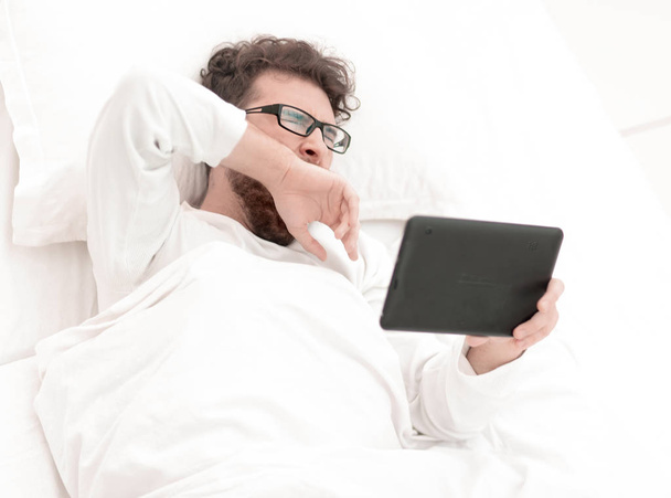 background image . man reading on digital tablet. - Фото, изображение