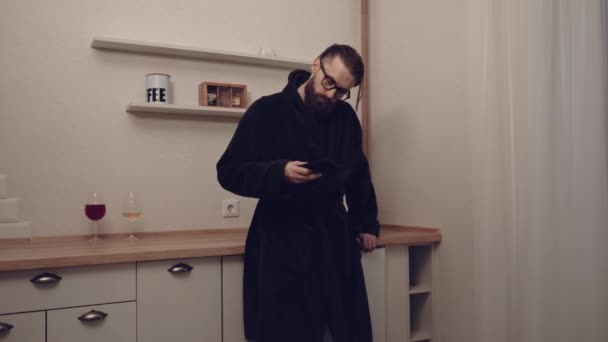 Bearded man with smartphone listening music - Záběry, video