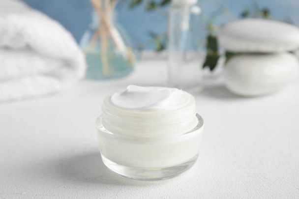 Jar of body care product on table - Foto, Imagen