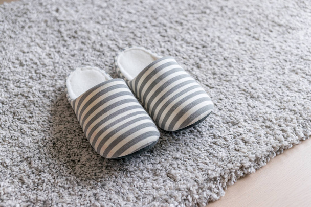 Slippers on carpet on the floor at home - Fotoğraf, Görsel