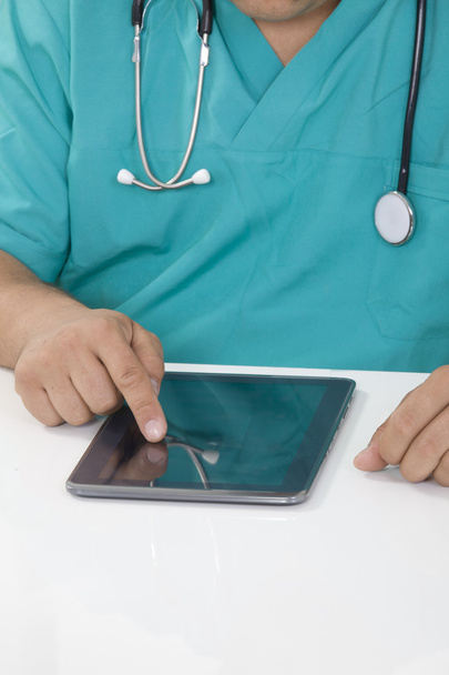 Doctor working on a digital tablet - Photo, image