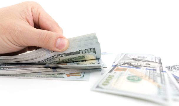 Dollars in hand on a white background - Φωτογραφία, εικόνα