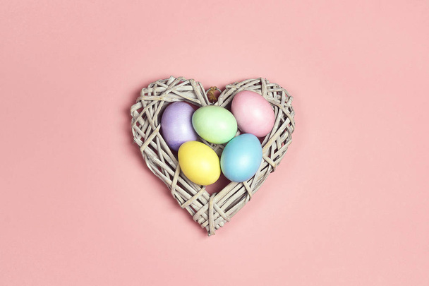 Colored Easter eggs in decorative heart. - Foto, afbeelding