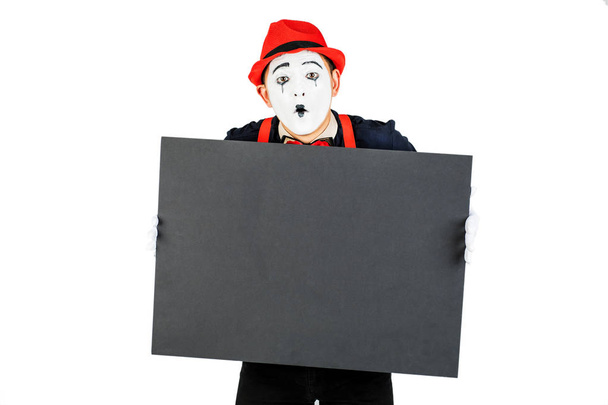 happy artist MIM is holding a black Board on a white background - Photo, Image