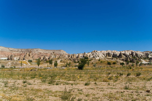 Fantastic landscape of Turkish Cappadocia and riders on horsebac - Valokuva, kuva