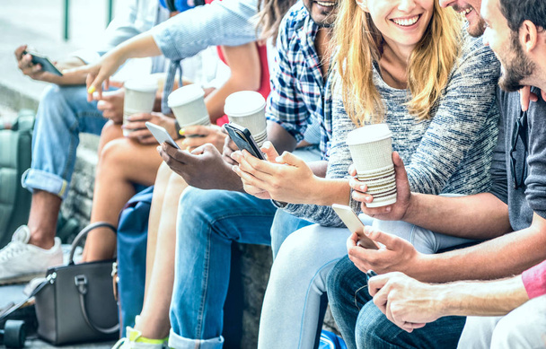 Millenial friends group using smartphone with coffee at university college - People hands addicted by mobile smart phone - Technology concept with always connected trendy millennials - Filter image - Photo, Image