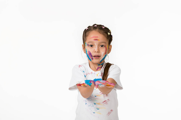 little child girl with hands painted in colorful paint - Foto, imagen