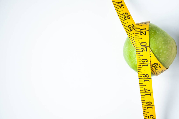 Diet and proper nutrition. Apples with meter. Background for the site.  - Photo, Image