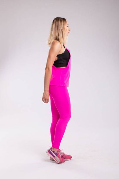 Fitness woman in sport style clothes. Copyplace, copy space. Iso - Foto, Imagen