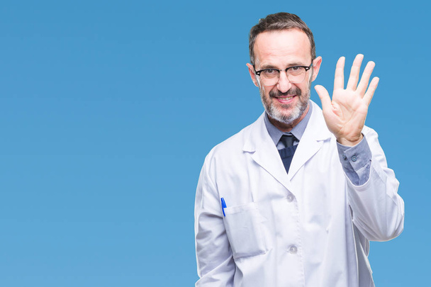 Middle age senior hoary professional man wearing white coat over isolated background showing and pointing up with fingers number five while smiling confident and happy. - Photo, Image
