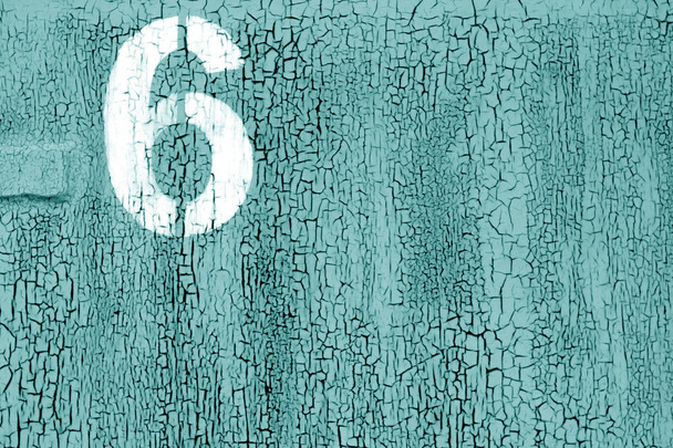 Number 6 in stencil on rusty metal wall in cyan color. - Photo, Image