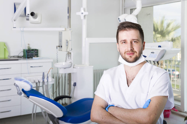 young male dentist in uniform in dental clinic - Photo, Image