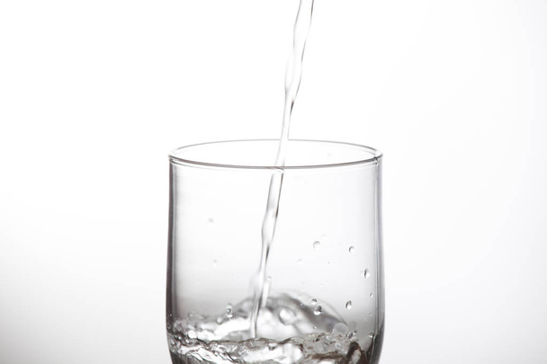 drinking glass of water or glass of water with undefined poison - Foto, imagen