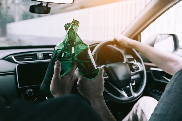 Two male friends are celebrating in the car while they are clink - Fotoğraf, Görsel