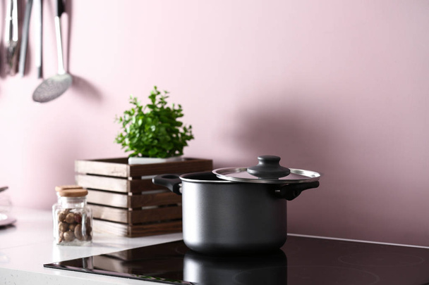 Saucepan on stove in kitchen - Photo, Image