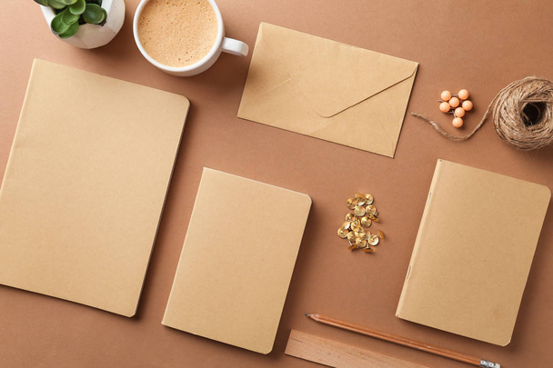 Stylish stationery with cup of coffee on color background - Φωτογραφία, εικόνα