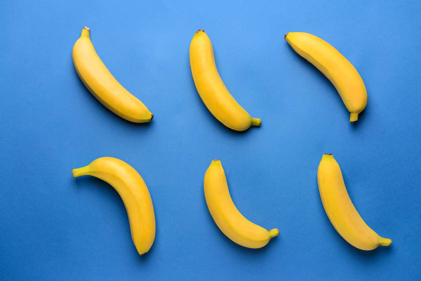 Ripe bananas on color background - Φωτογραφία, εικόνα