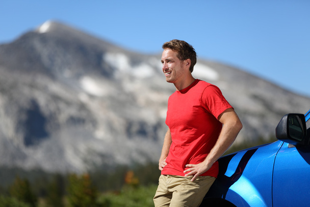 Car and driver man in beautiful mountain landscape - Photo, Image
