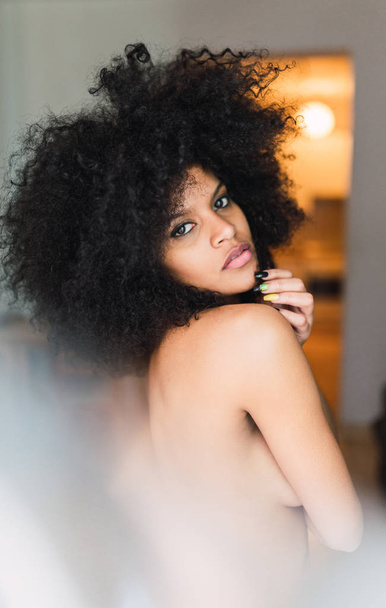 Young charming naked black woman in room - Valokuva, kuva