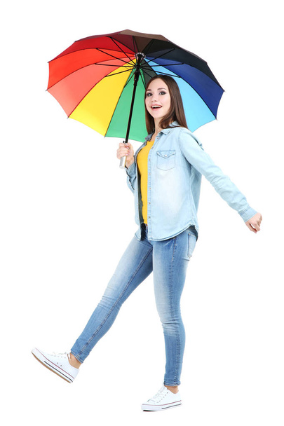 Young girl with colorful umbrella isolated on white background - Foto, Imagen