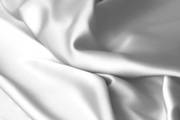 Rippled white silk fabric satin cloth waves background - Foto, afbeelding