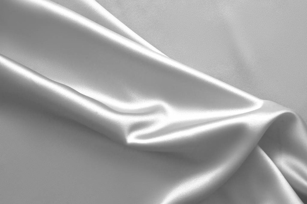 Rippled white silk fabric satin cloth waves background - Fotoğraf, Görsel