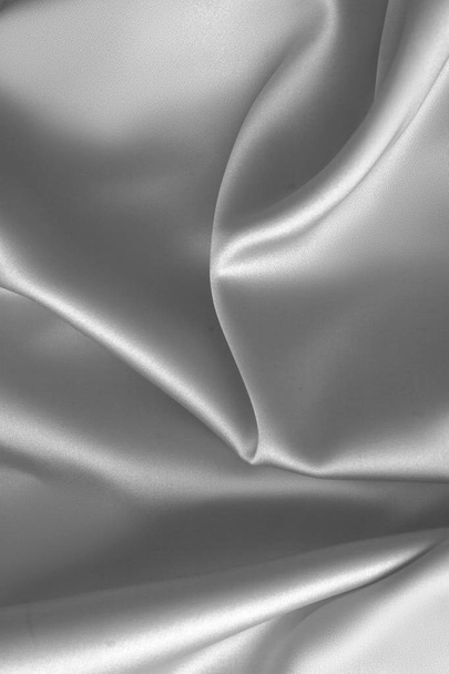 Golfde witte zijde stof satijn doek golven achtergrond - Foto, afbeelding