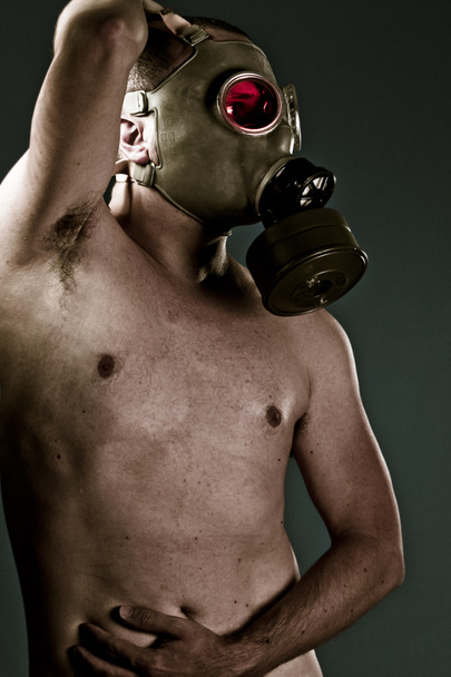 attractive man with gas mask, nude portrait - Zdjęcie, obraz