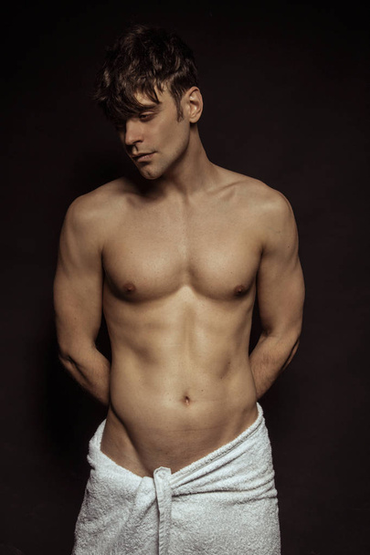 Handsome sport sexy stripped guy portrait in underwear on isolated black background - Φωτογραφία, εικόνα