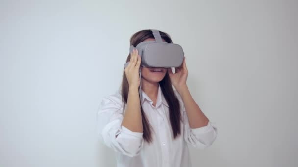 happy young woman with virtual reality headset or 3d glasses playing game - Imágenes, Vídeo