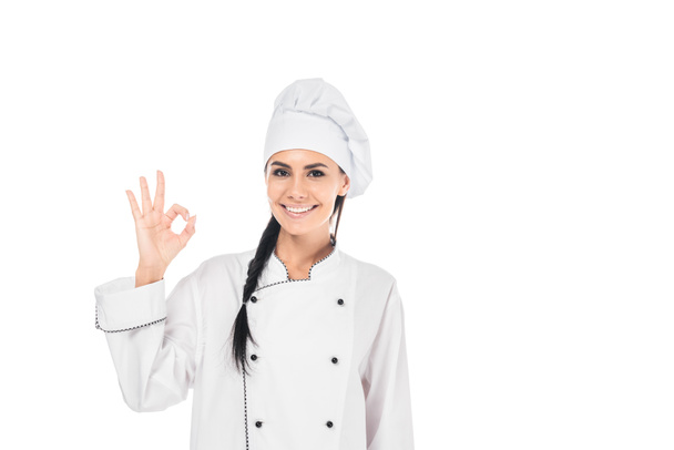 Smiling chef in hat showing okay sign isolated on white - Valokuva, kuva