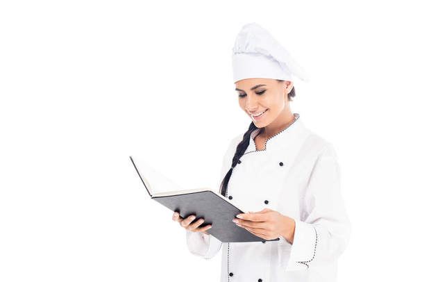 Mosolyogva chef olvasó cookbook elszigetelt fehér kalap - Fotó, kép
