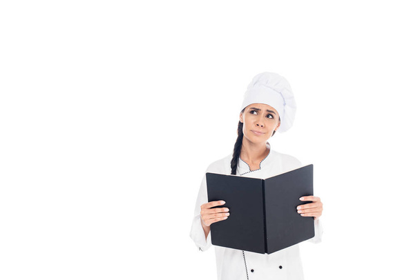 Cuoco triste in uniforme tenuta libro nero isolato su bianco
 - Foto, immagini