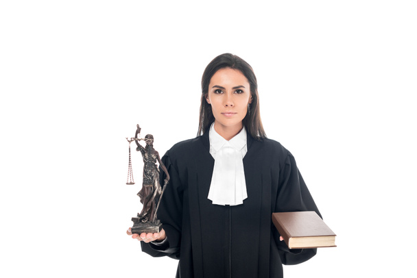Judge in judicial robe holding themis figurine and book isolated on white - Photo, Image