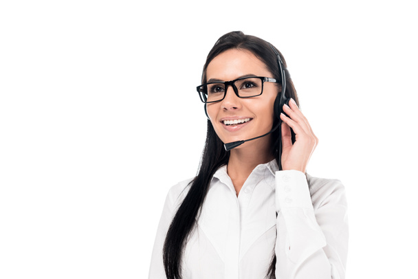 Uśmiechający się operator centrum wywołania w okularach, dotykając zestaw słuchawkowy na białym tle - Zdjęcie, obraz