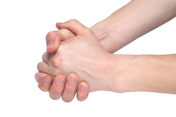 mannelijke handen in de vorm van slot houden dat elkaar geïsoleerd op wit - Foto, afbeelding