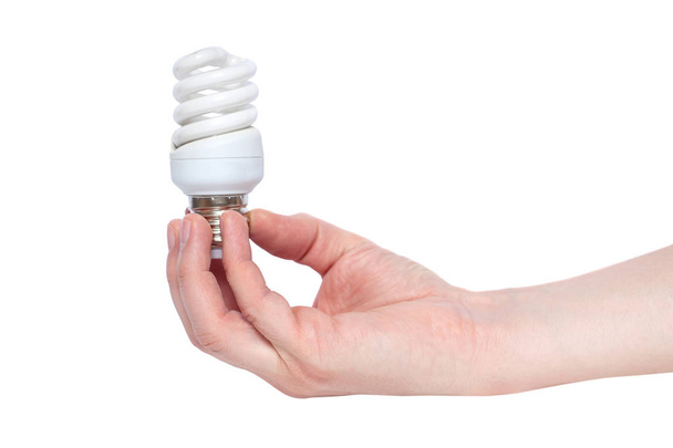 Hand holding Illuminated light bulb isolated on white background - Фото, зображення