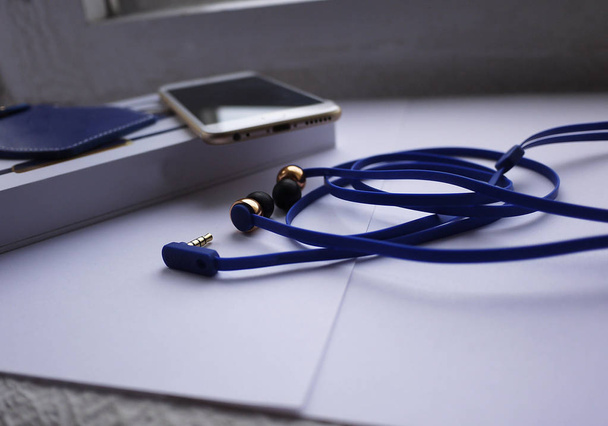 Small earphones-plugs for listen music - Foto, afbeelding
