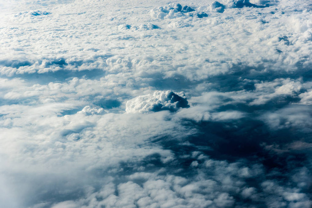 Top view of white clouds above the ground or water - Foto, immagini