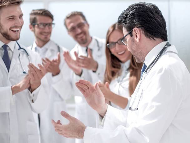 group of doctors applauding each other - Valokuva, kuva