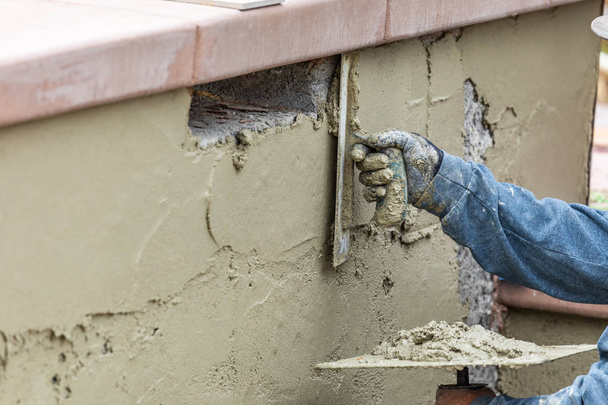 Tile Worker Applying Cement with Trowel at Pool Construction Sit - Foto, Imagem