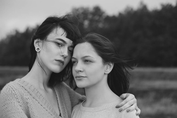 Two women on the field. Black and white - Fotografie, Obrázek
